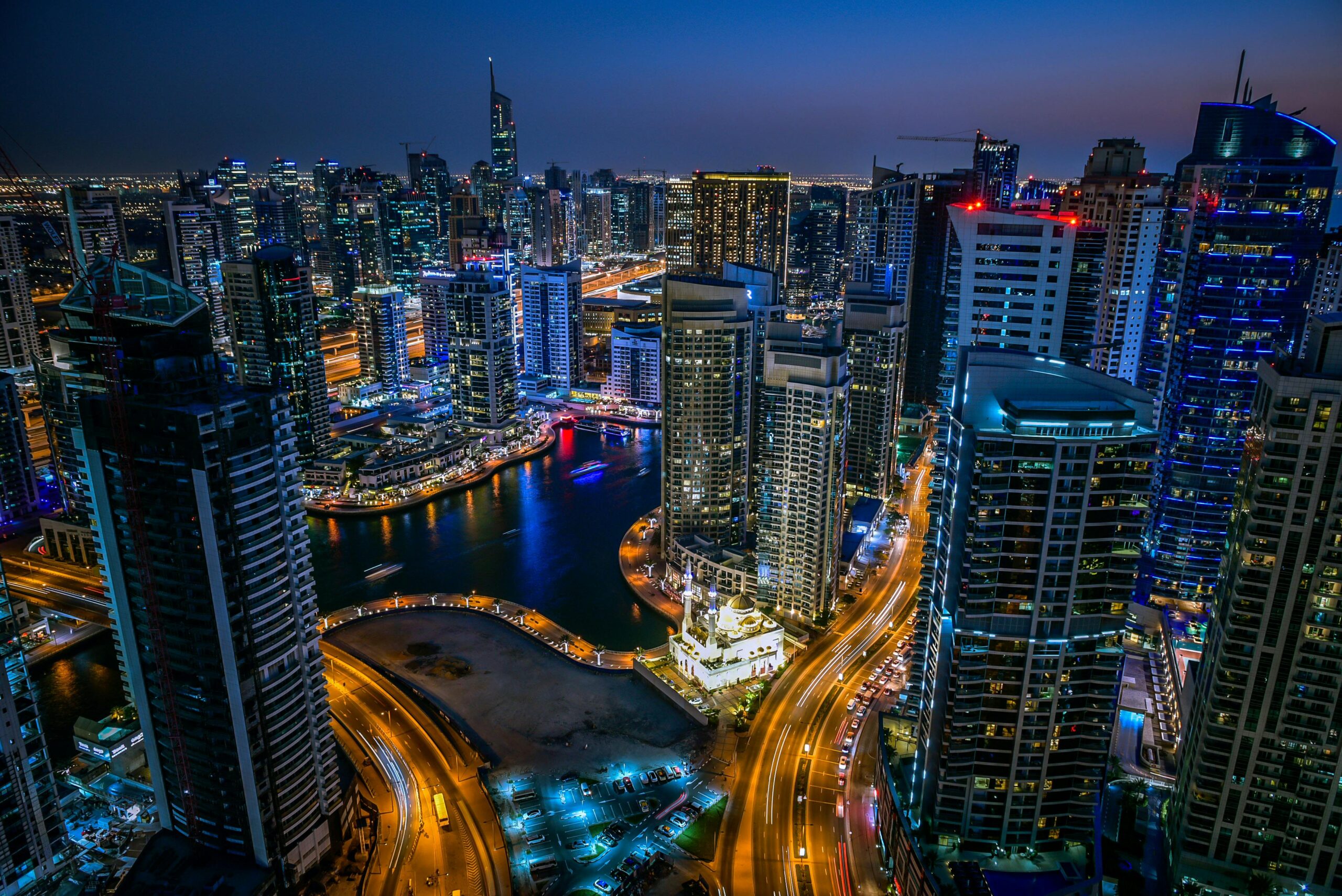 A captivating night view of Dubai's cityscape with vibrant lights and towering skyscrapers.