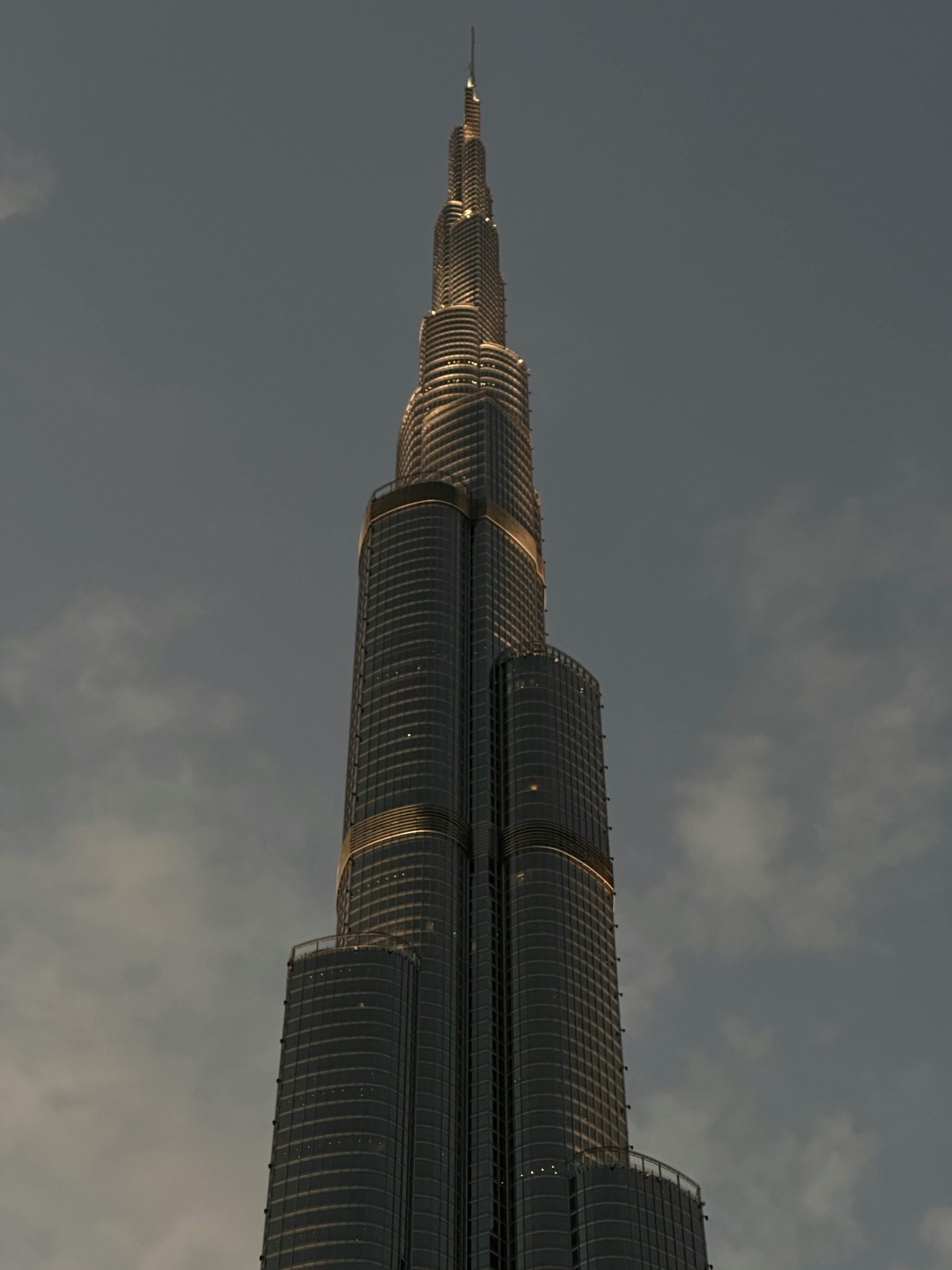 Stunning architectural view of Burj Khalifa in Dubai during twilight, showcasing its grandeur.