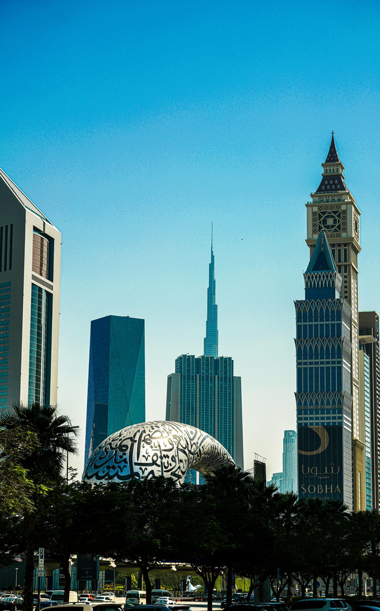 A stunning view of Dubai's modern skyline featuring the Burj Khalifa and distinctive architecture under a clear blue sky.